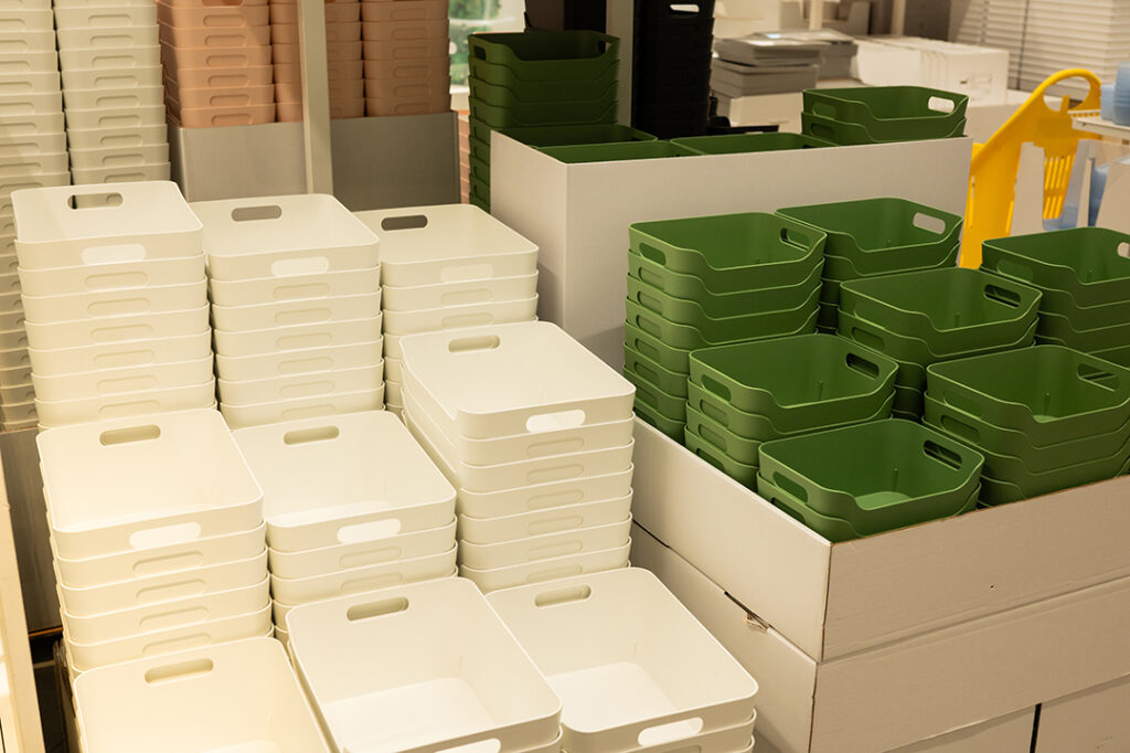 stacked white and green plastic storage bins in st 2025 08 27 08 37 37 utc